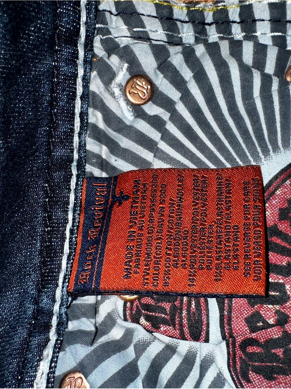 Rock Revival Men's Dark Blue Denim Jeans with Red Interior Tag